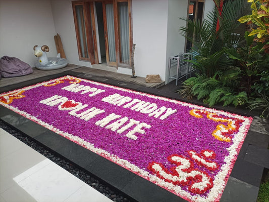 pool flower decorations in bali for birthdays using purple flowers