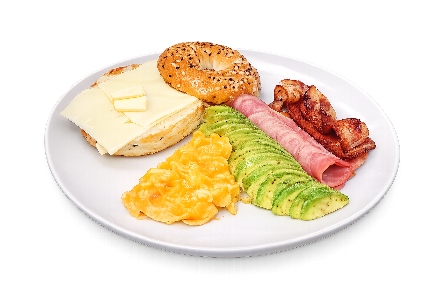 Breakfast plate with bagel, cheese, eggs, avocado, ham, and bacon on a white background