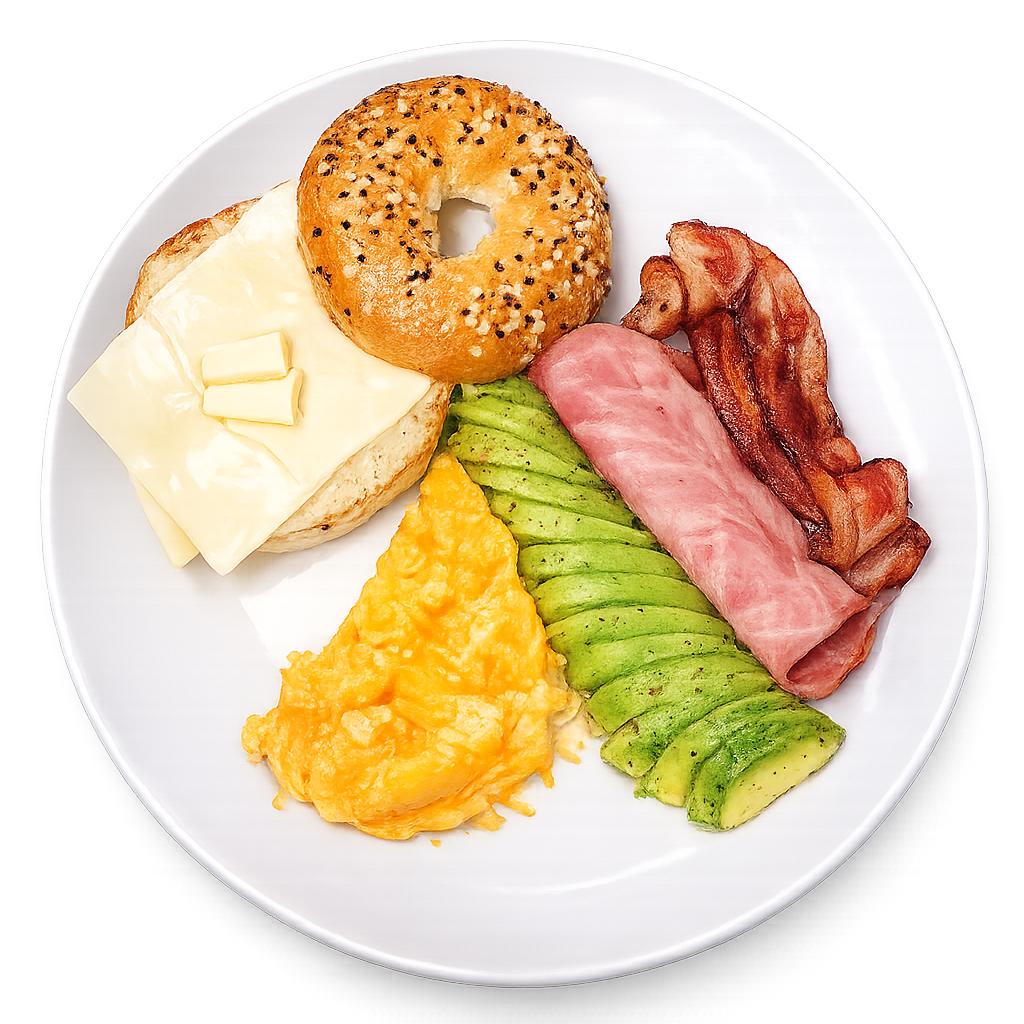 Breakfast plate with bagel, cheese, bacon, avocado, and eggs on a white background