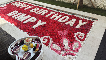 flower petals decoration in the pool in a villa bali written happy birthday dimpy