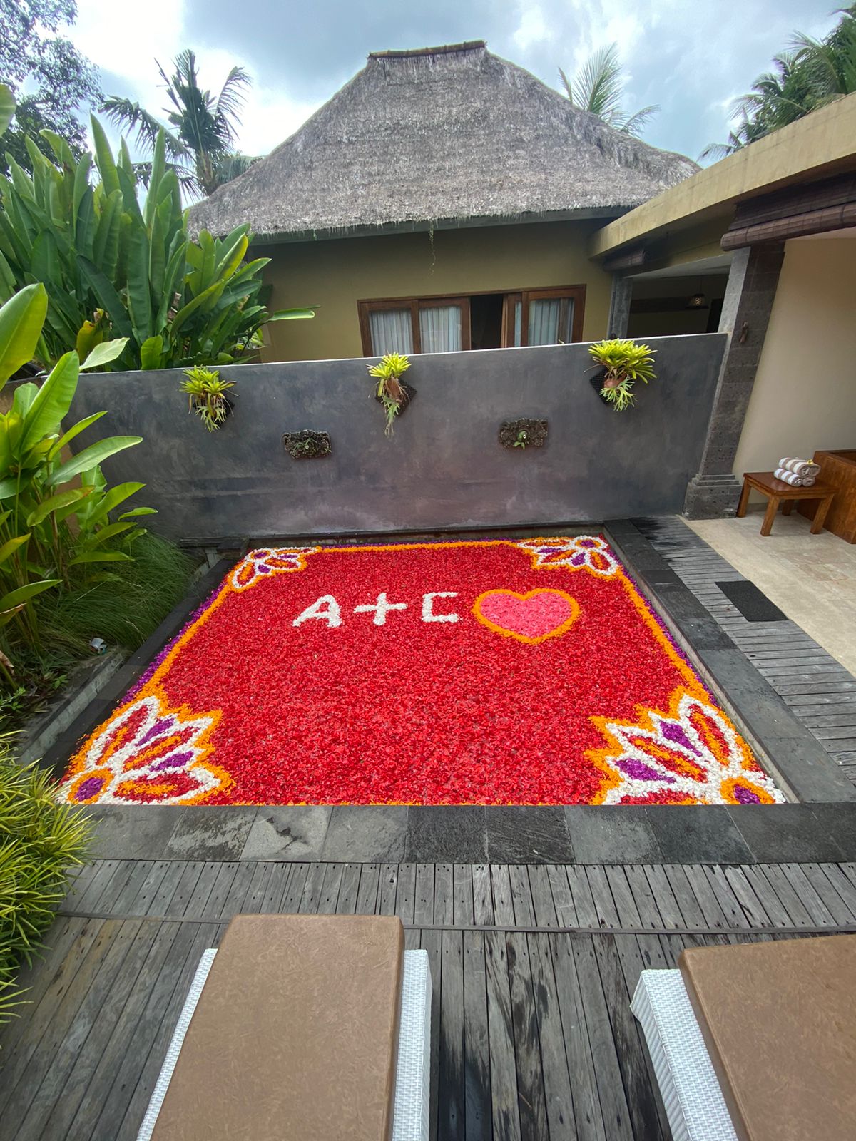 a 4 by 6 meter pool in ubud decorated with flower petals for honeymoon